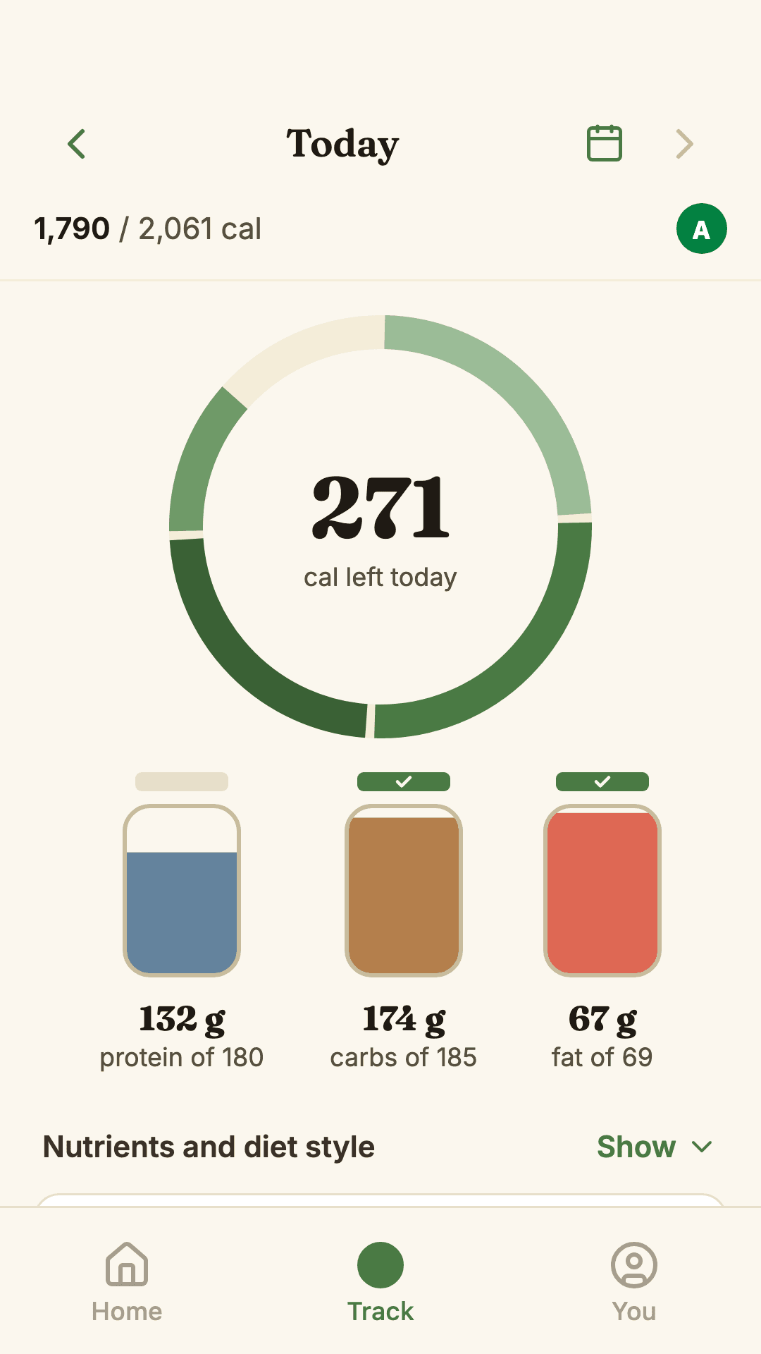 Wholesum's Track tab: 271 calories left today from a 2,061 target, with protein, carbs and fat shown as three jars filling up.